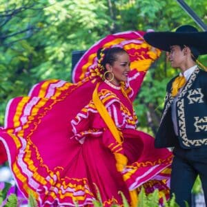 Man and woman dancing traditional Mexican dance
