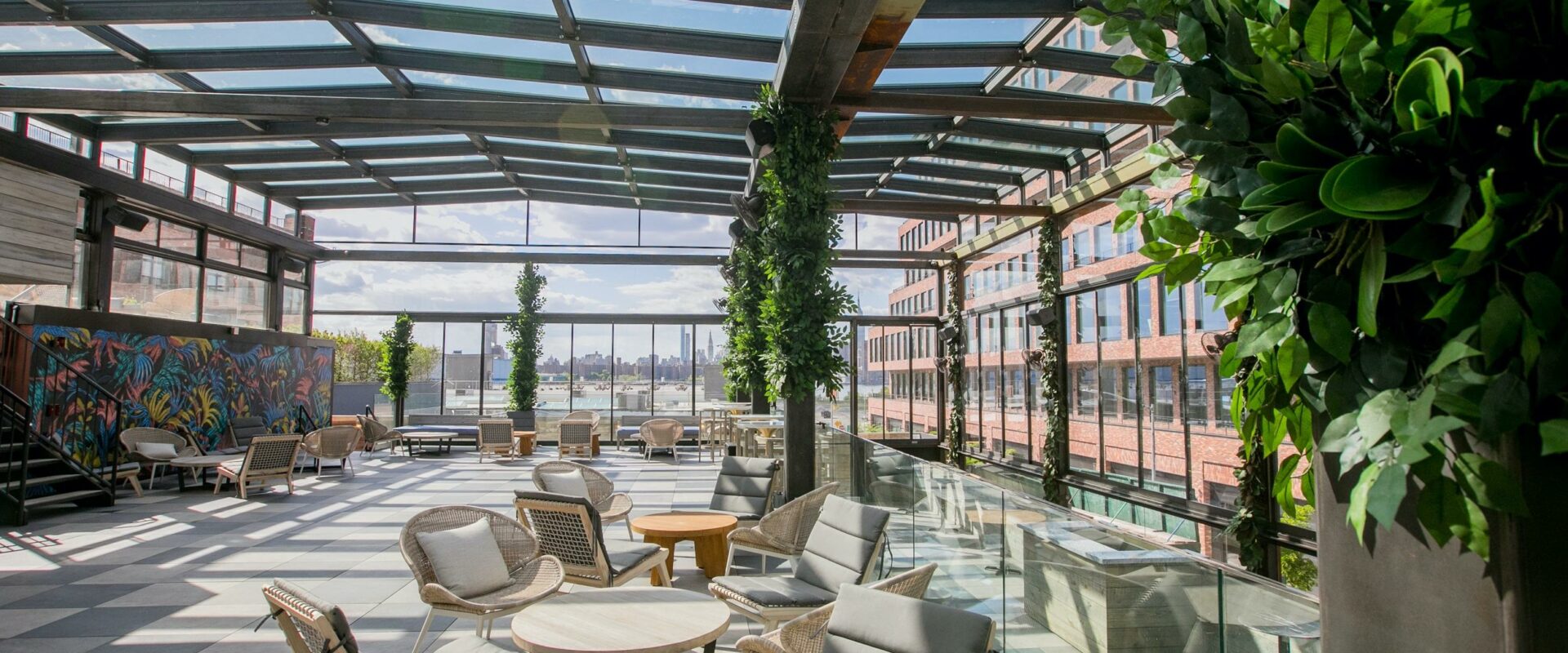 Indoor garden seating area with glass roof