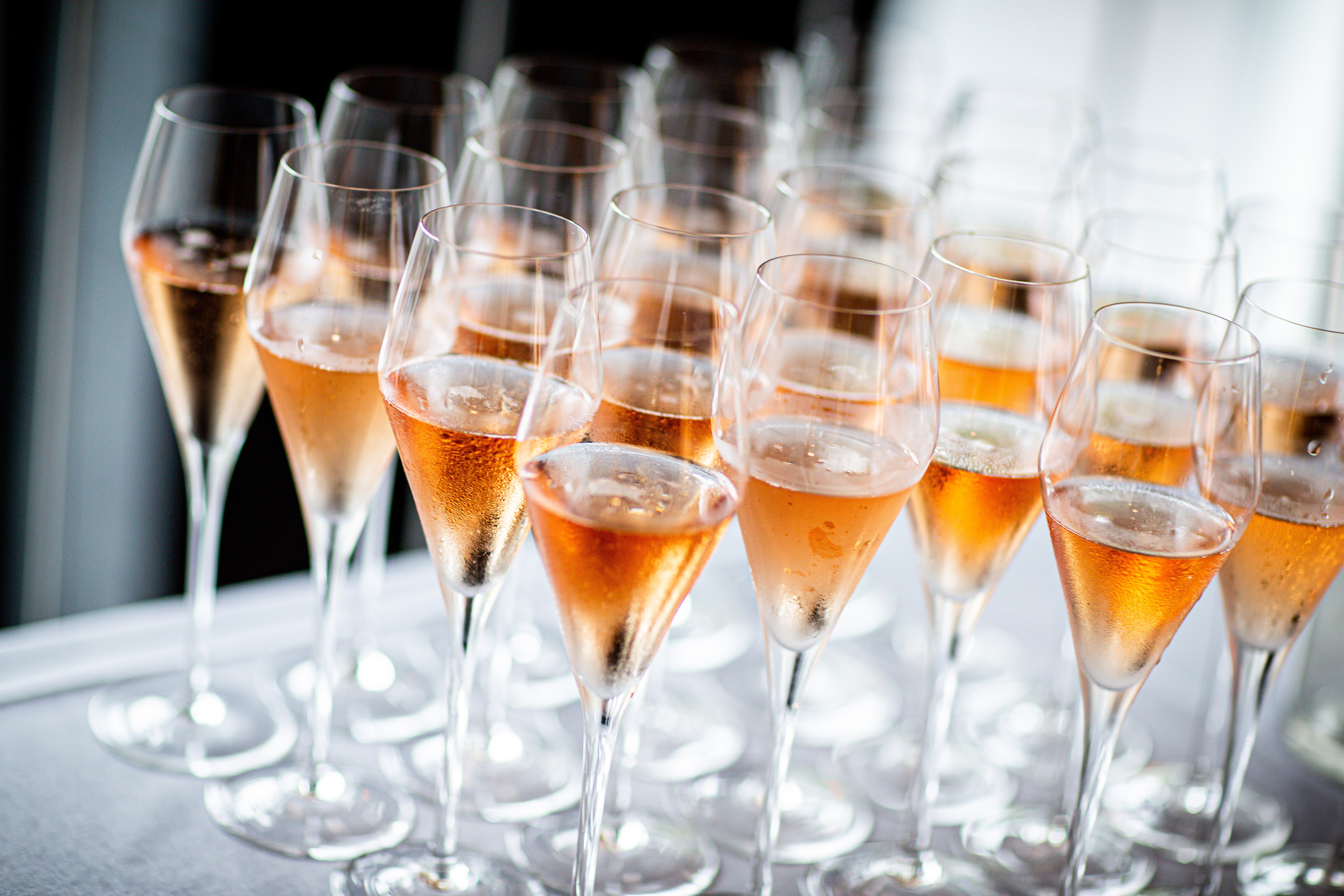 Rose wine glasses at a holiday party